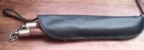Nunchakus in zipper pouch. Lenght 30 cm.