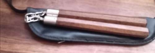 Nunchakus in zipper pouch. Lenght 30 cm.