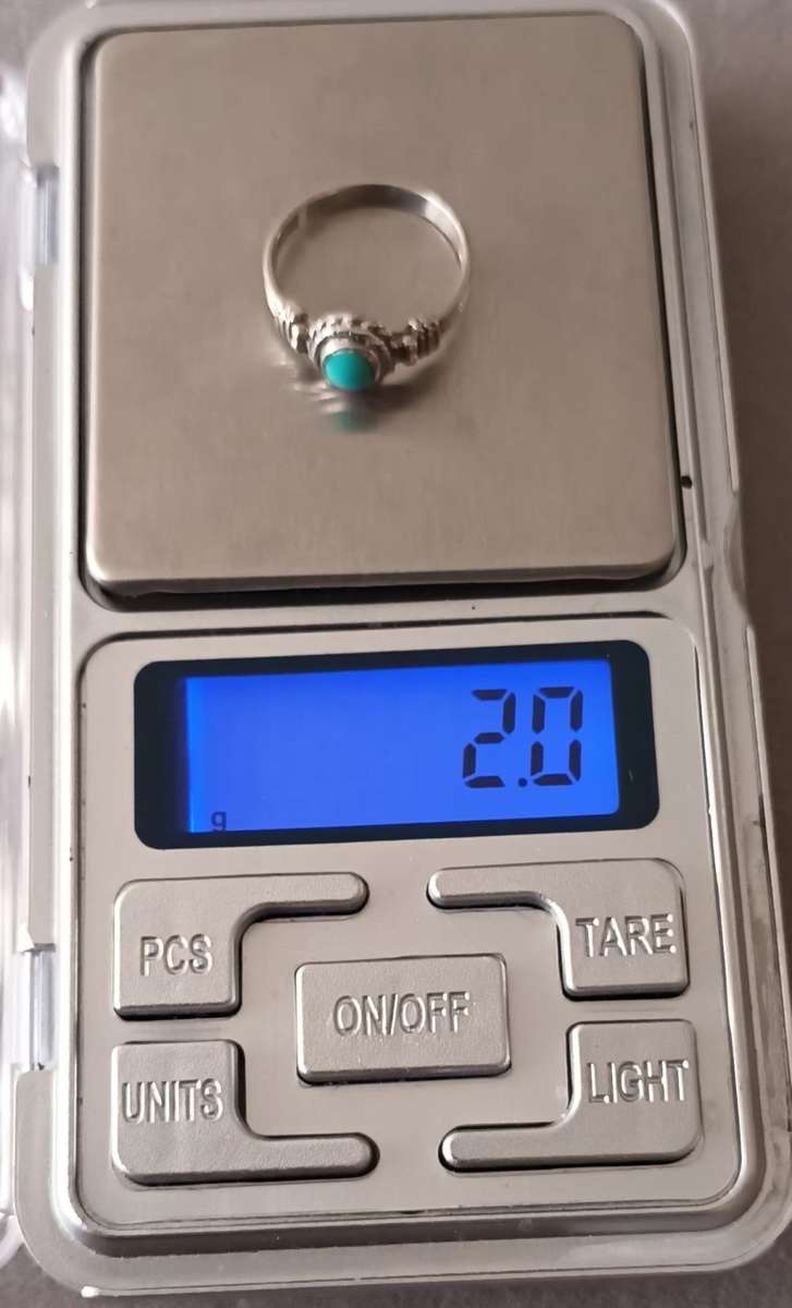 Sterling Silver Ring with Turquoise Stone. 2g. Size K.