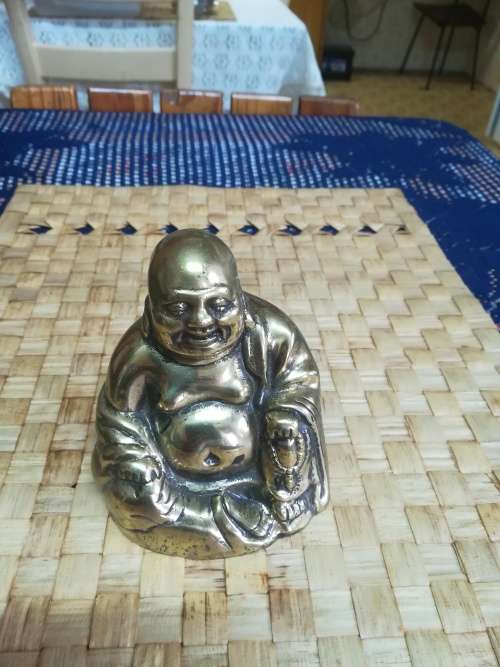Brass Budha ornament.