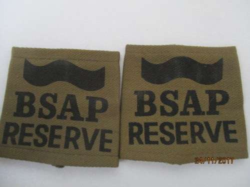 TWO PAIRS. RHODESIAN B S A P RESERVE SHOULDER SLIP ON TABS