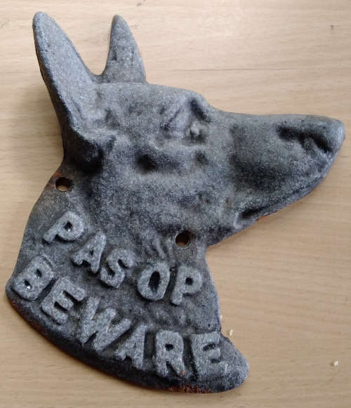 Metal dog beware sign