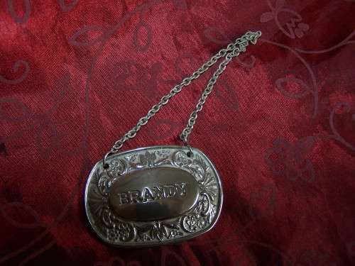 Silver plated brandy label on chain