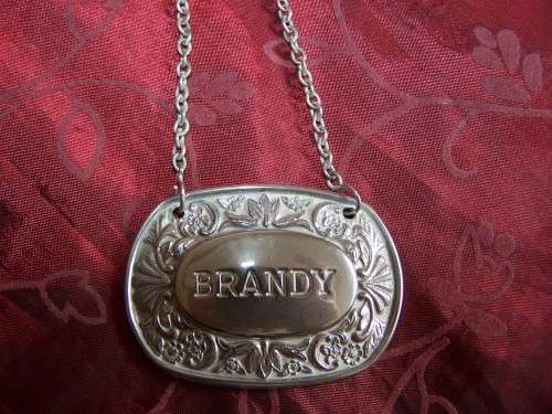 Silver plated brandy label on chain