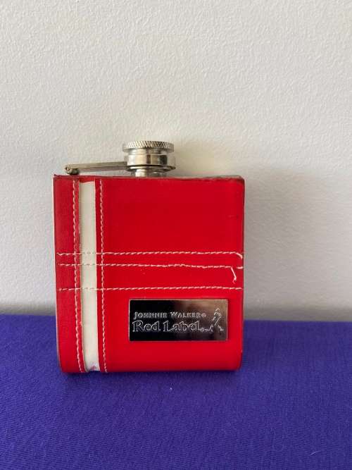 JOHNNIE WALKER LABELLED RED LEATHER CASED HIP FLASK