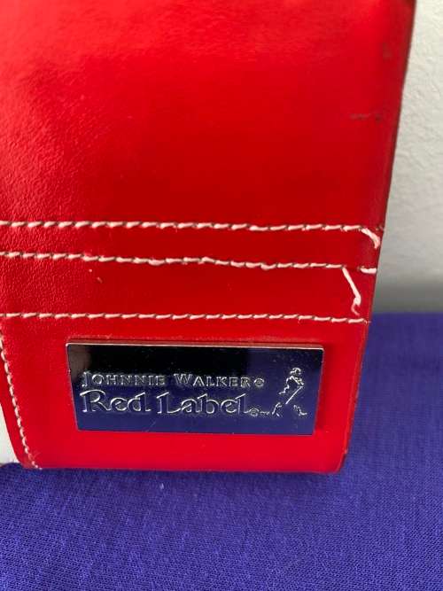 JOHNNIE WALKER LABELLED RED LEATHER CASED HIP FLASK