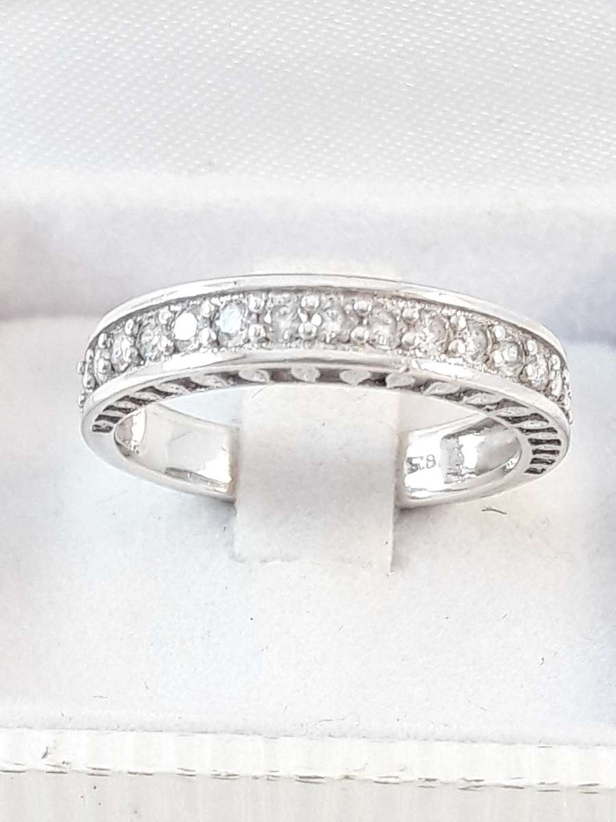 Sterling silver half eternity ring with clear zirconias