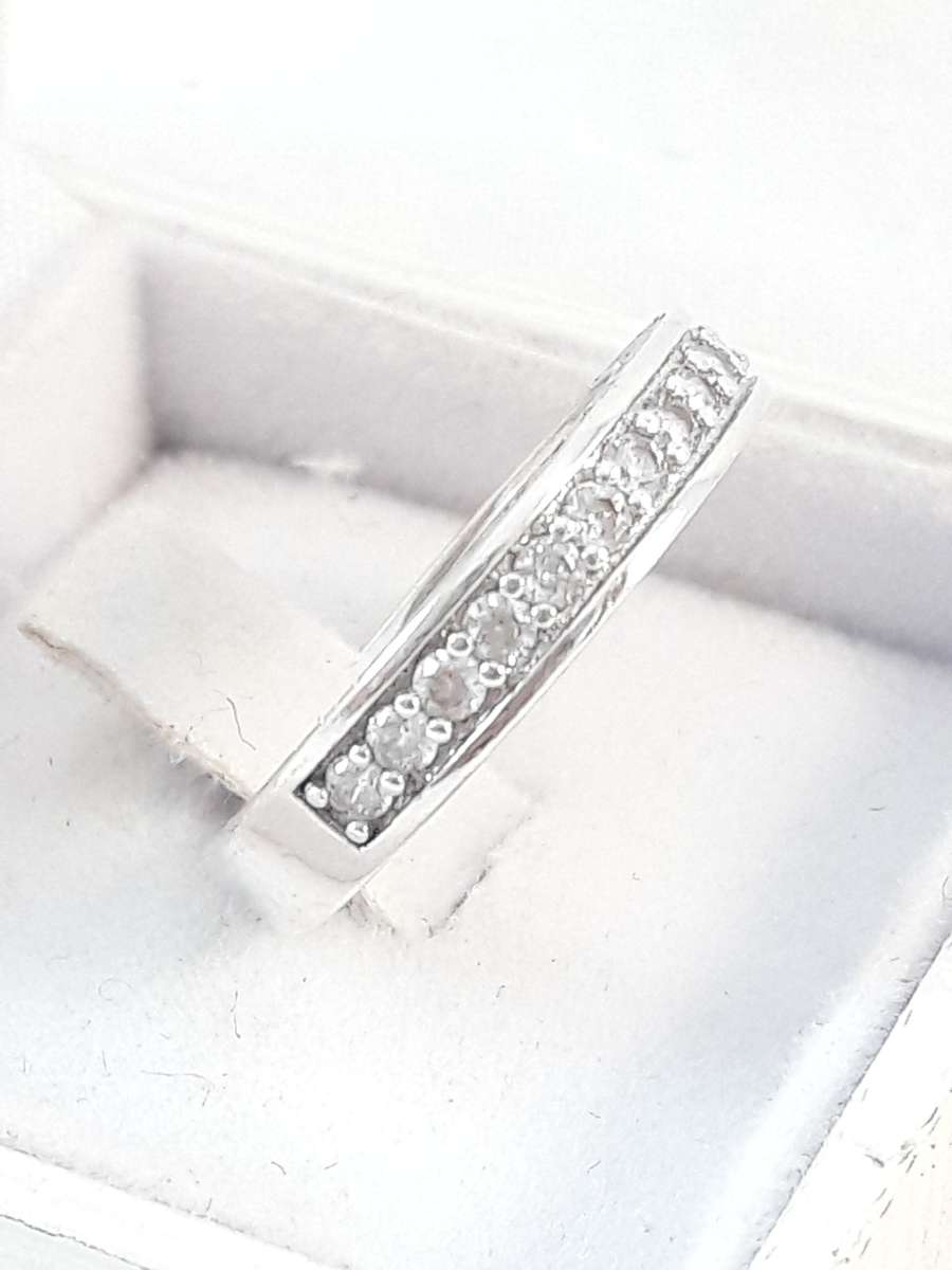 Sterling silver half eternity ring with clear zirconias