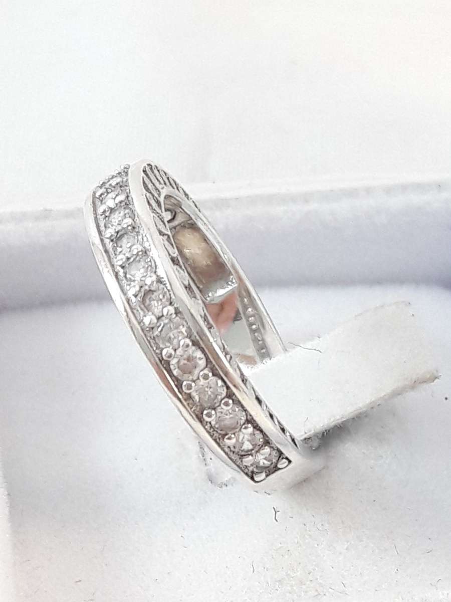 Sterling silver half eternity ring with clear zirconias