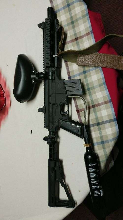 TPN Sierra One paintball marker with gas bottle and 200 round hopper. Come in original box.