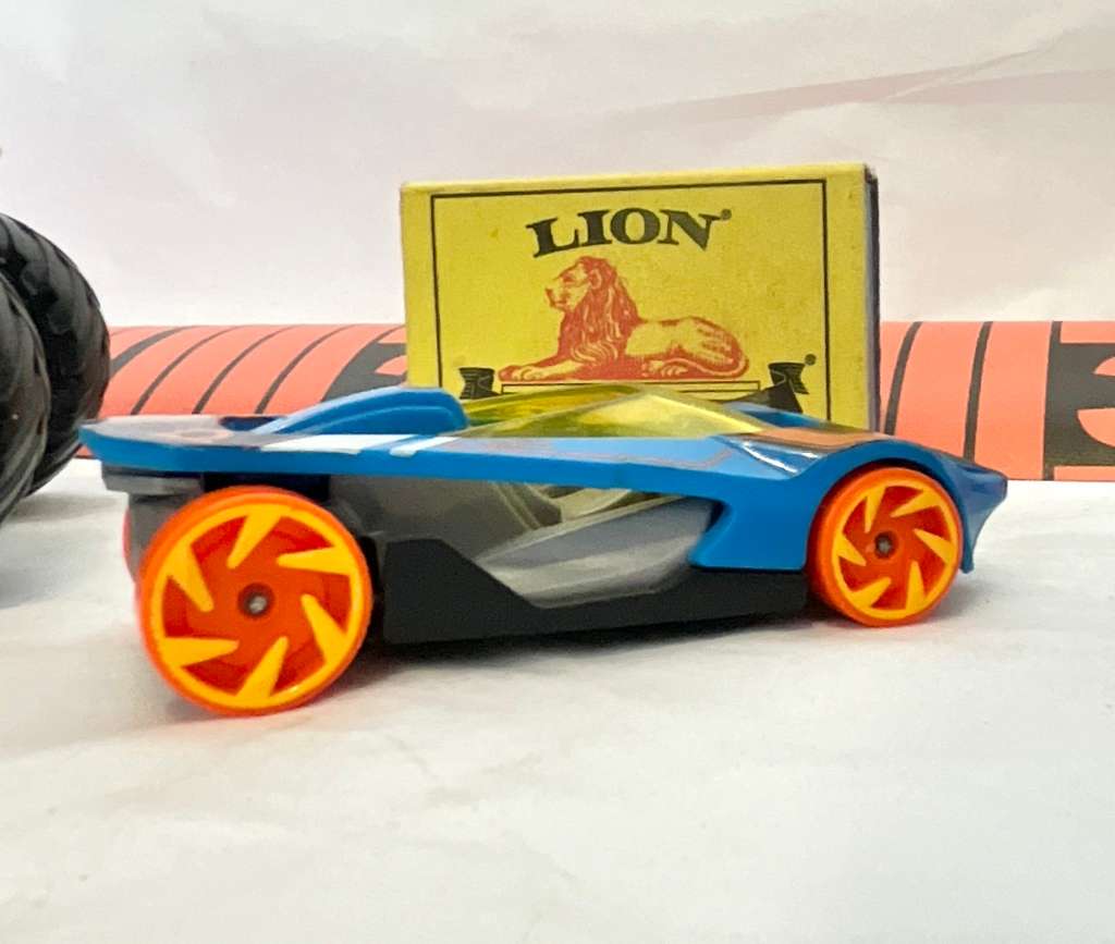 Assorted three toy cars, including a Monster Jam model