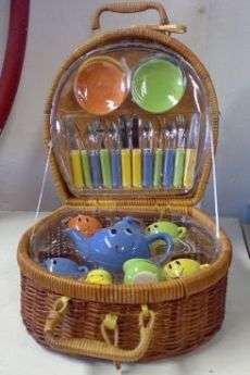 Porcelain cup and saucer toy picnic set in wicker basket