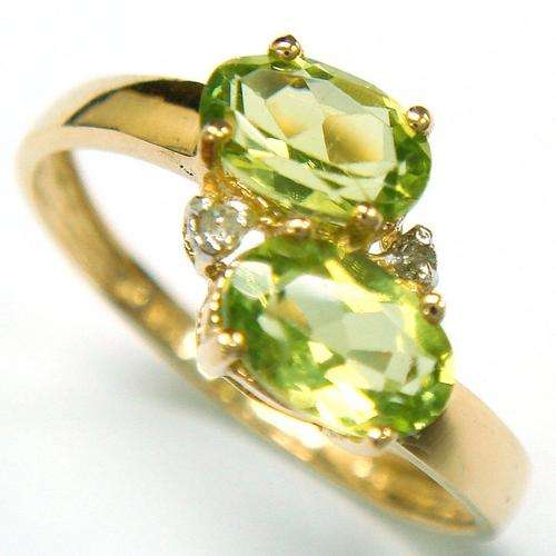Beautiful solid 9kt gold and genuine peridot and diamond ring.