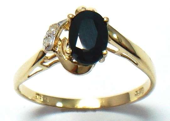 Beautiful solid 9kt gold and genuine black sapphire and diamond ring.