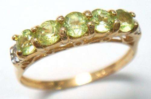 Beautiful solid 9kt gold and genuine peridot and diamond ring.