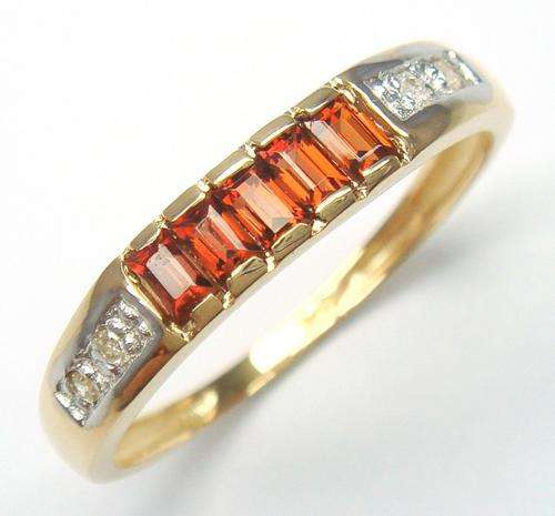 Beautiful solid 9kt gold genuine garnet and diamond ring.