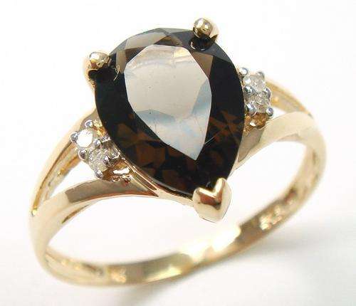 Beautiful solid 9kt gold genuine smokey topaz and diamond ring.