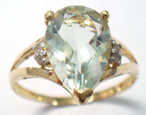 Beautiful solid 9kt gold genuine green amethyst and diamond ring.