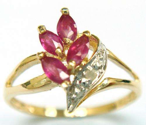 Beautiful solid 9kt gold genuine ruby and diamond ring.