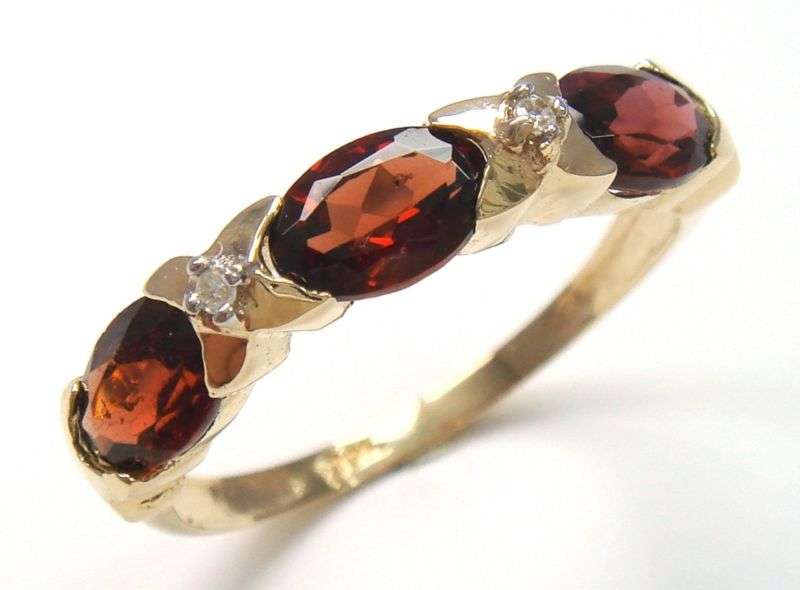 Beautiful solid 9kt gold genuine garnet and diamond ring.