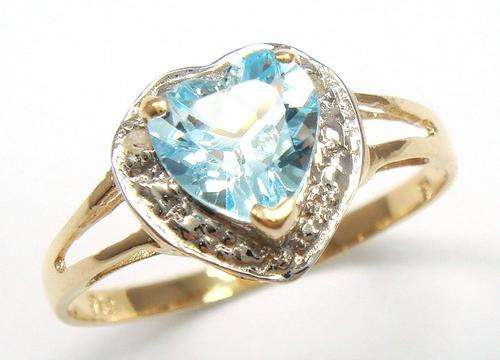 Beautiful solid 9kt gold and genuine topaz and diamond ring.