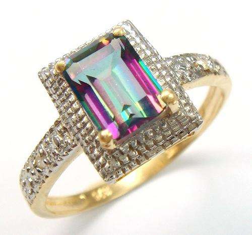 Beautiful solid 9kt gold and genuine mystic topaz and diamond ring.