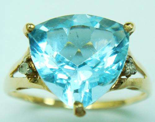 Beautiful solid 9kt gold and genuine topaz and diamond ring.