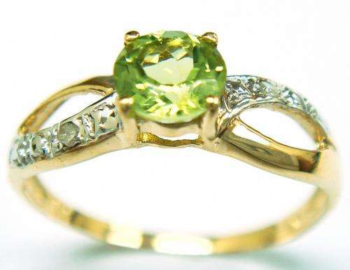 Beautiful solid 9kt gold and genuine peridot and diamond ring.