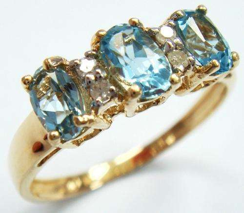 Beautiful solid 9kt gold and genuine topaz and diamond ring.