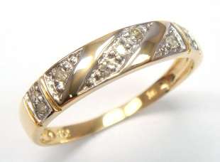 Beautiful solid 9kt gold and 9 genuine diamonds ring.