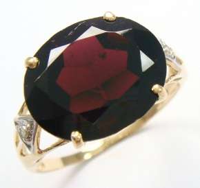 Beautiful solid 10kt gold and genuine garnet and diamonds ring.