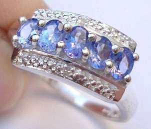 Beautiful genuine tanzanite and diamonds ring.