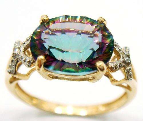 Beautiful solid 9kt gold and genuine mystic topaz and diamonds ring.