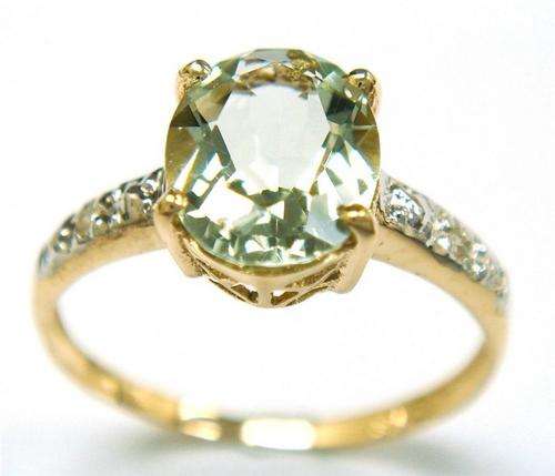 Beautiful solid 9kt gold and genuine green amethyst and diamonds ring.