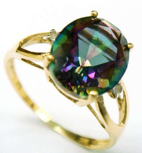 Beautiful solid 9kt gold and genuine mystic topaz and diamond ring.