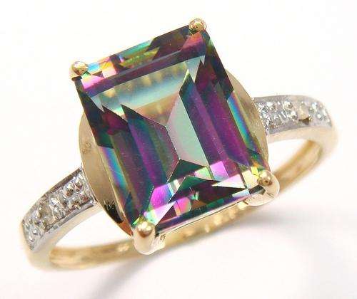Beautiful solid 9kt gold and genuine mystic topaz and diamond ring.