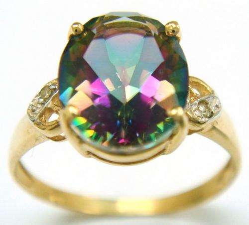 Beautiful solid 10kt gold and genuine mystic topaz and diamond ring.