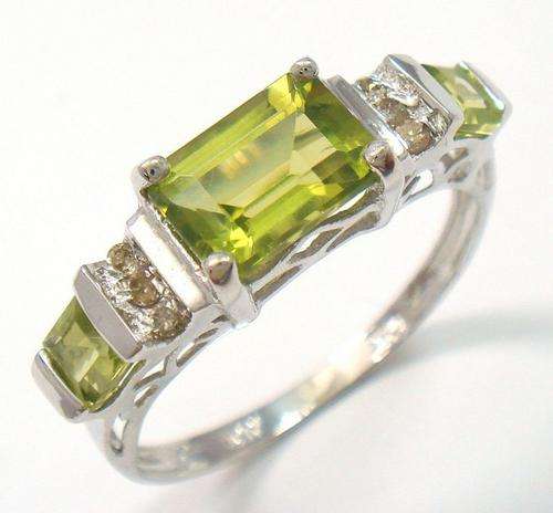 Beautiful solid 10kt white gold and genuine peridot and diamond ring.