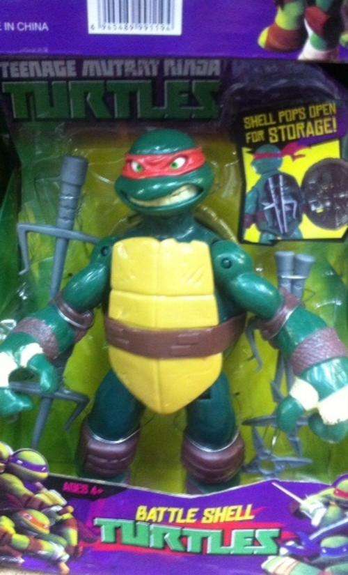 reduced Ninja turtles moveable plastic figurine 27cm - with weapons - shell pops open  - red