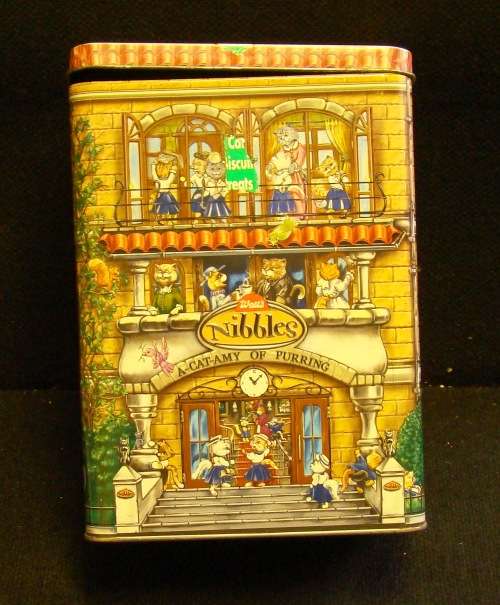 Nibbles cat and Beeno Eaton College biscuit tins