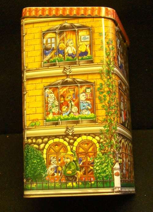 Nibbles cat and Beeno Eaton College biscuit tins