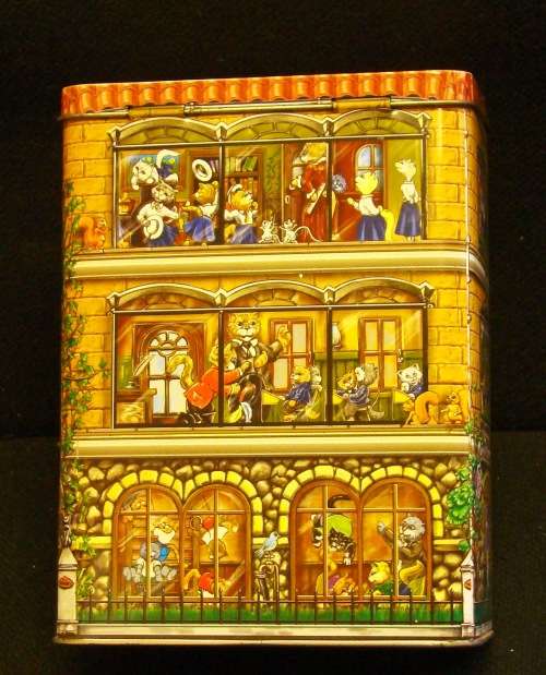 Nibbles cat and Beeno Eaton College biscuit tins