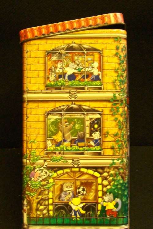Nibbles cat and Beeno Eaton College biscuit tins