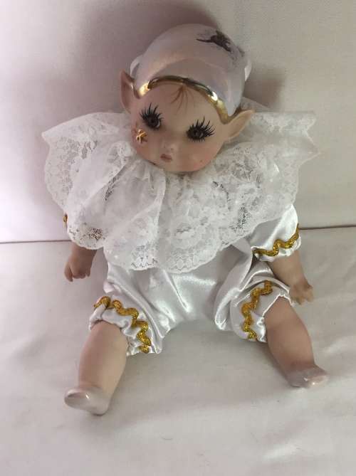 Medium Porcelain Pixi doll dressed in white coloured suite - Artist JR 1999