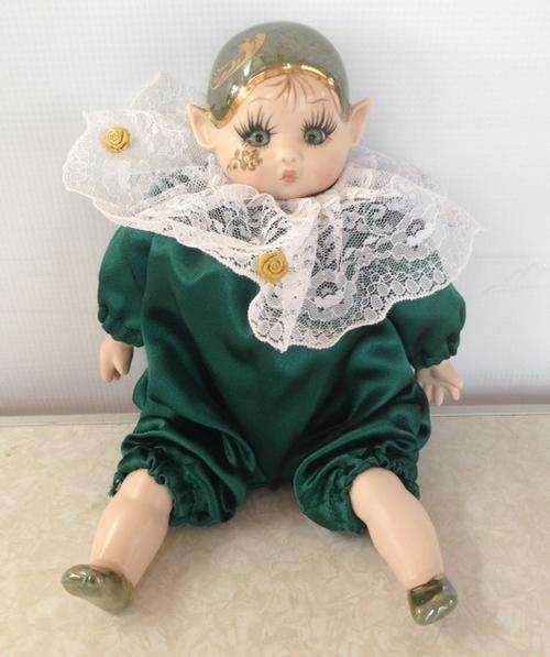 Small Porcelain Pixie doll dressed in green suite - Artist 'Loe'