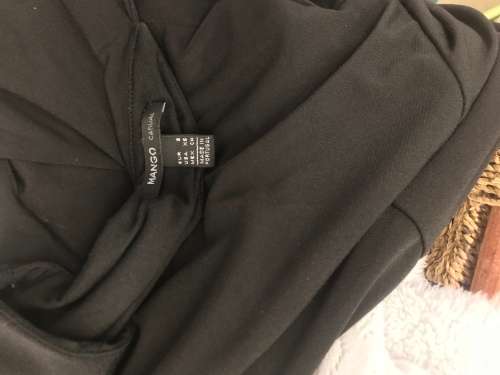 Suits 12 / 36 designer is MANGO  stunning black dress with cut out A-Line.