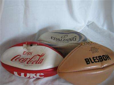 THREE RUGBY BALLS...