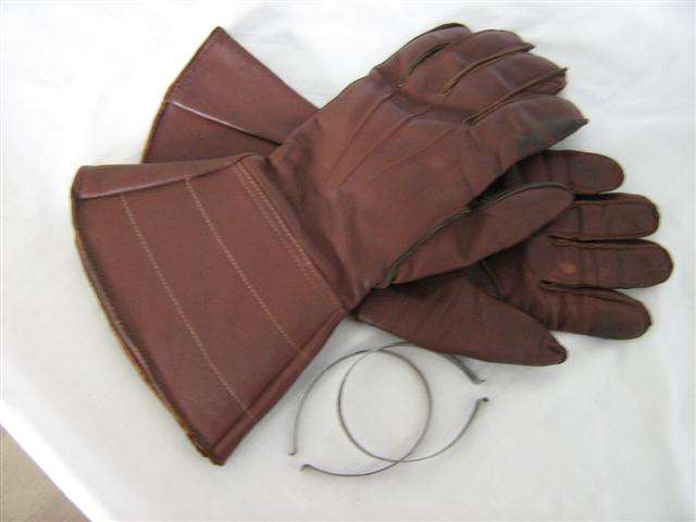 VINTAGE LEATHER MOTOR CYCLE GAUNTLETS TOGETHER WITH A PAIR SPRING STEELTROUSER CLIPS