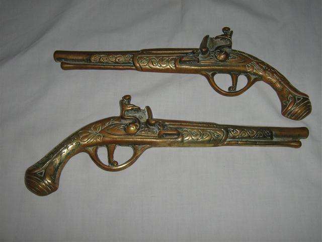 BRASS.. WALL HANGING VINTAGE STYLE PISTOL SET..FLAT BACKED