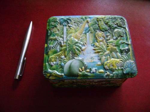 Embossed tin  with animal jungle features  (14 x 12 x 6 cm)